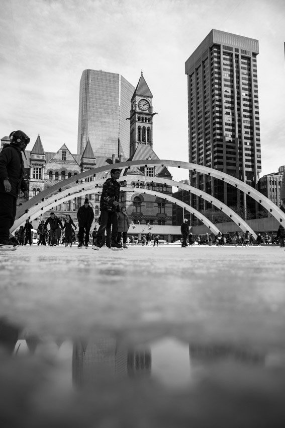 Toronto black and white Nathan Phillips Square Skating